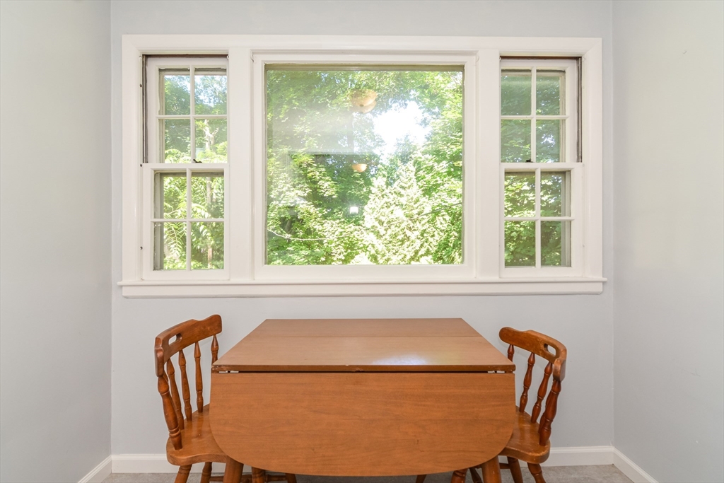 39 Beechmont Street Worcester, MA 01609 - Photo 13 of 42 a view of a dining room with furniture and a window