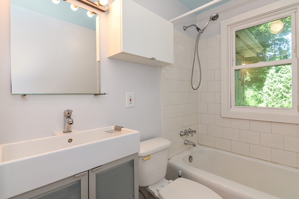 39 Beechmont Street Worcester, MA 01609 - Photo 17 of 42 a bathroom with a sink a toilet and a bathtub