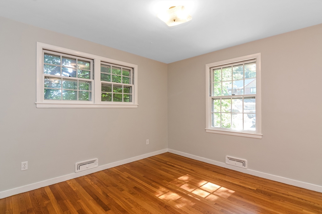 39 Beechmont Street Worcester, MA 01609 - Photo 18 of 42 a view of a room with wooden floor and windows