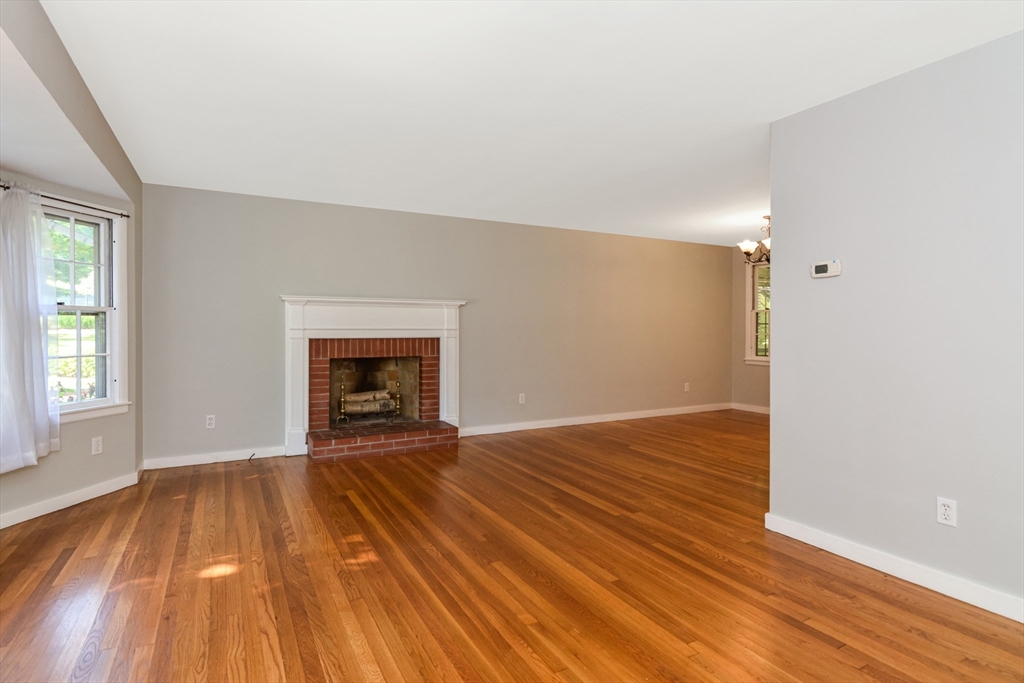 39 Beechmont Street Worcester, MA 01609 - Photo 2 of 42 wooden floor fireplace and windows in an empty room