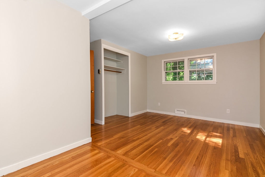 39 Beechmont Street Worcester, MA 01609 - Photo 21 of 42 an empty room with wooden floor and windows