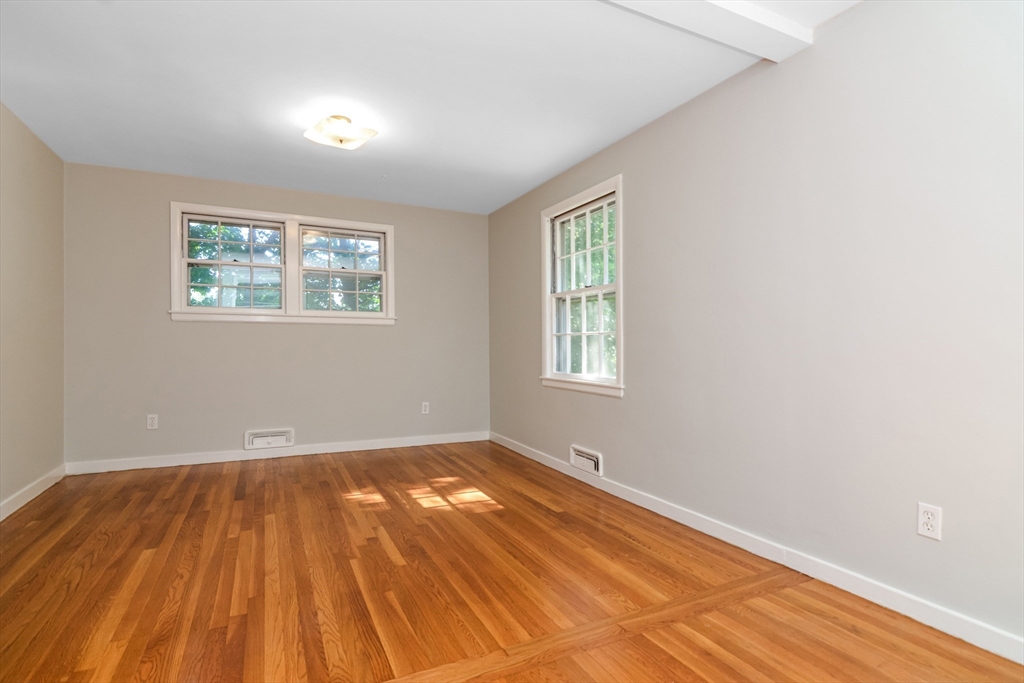39 Beechmont Street Worcester, MA 01609 - Photo 22 of 42 an empty room with wooden floor and windows