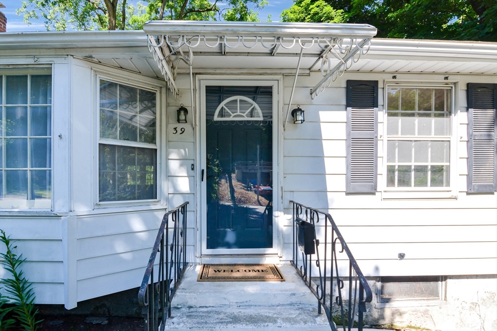 39 Beechmont Street Worcester, MA 01609 - Photo 29 of 42 a view of a wooden house with a window