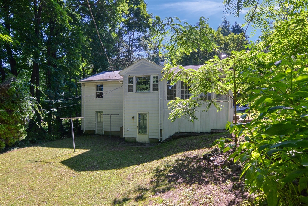 39 Beechmont Street Worcester, MA 01609 - Photo 35 of 42 a front view of a house with a yard