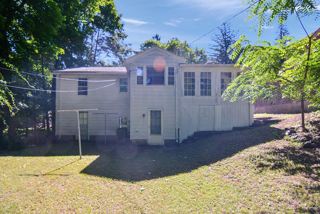 39 Beechmont Street Worcester, MA 01609 - Photo 36 of 42 a front view of a house with a yard