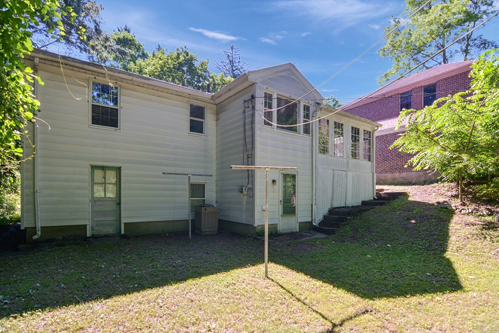 39 Beechmont Street Worcester, MA 01609 - Photo 37 of 42 a front view of a house with a garden