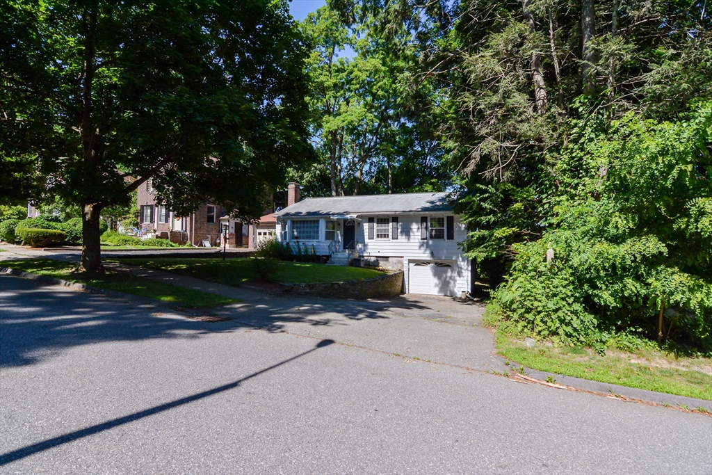 39 Beechmont Street Worcester, MA 01609 - Photo 38 of 42 a front view of a house with a yard