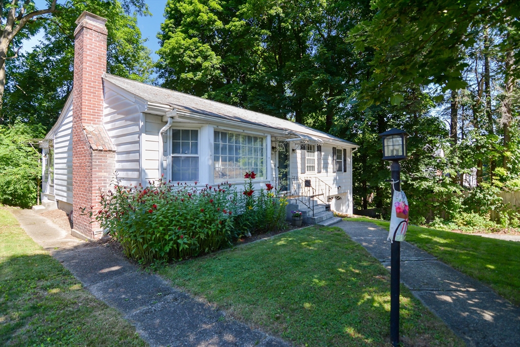 39 Beechmont Street Worcester, MA 01609 - Photo 40 of 42 a view of a house with backyard and a tree