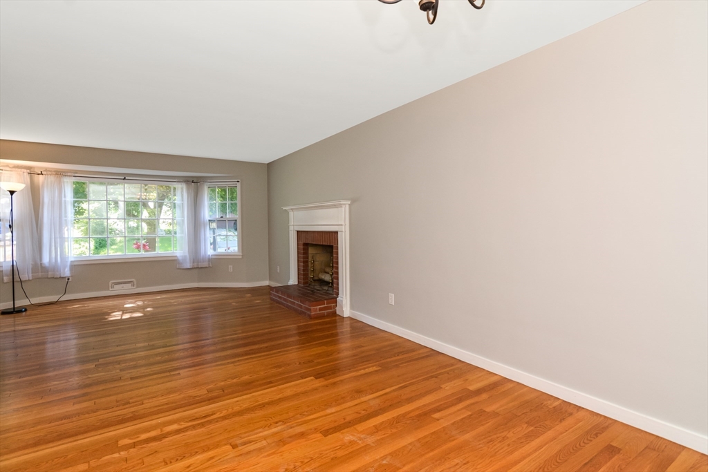 39 Beechmont Street Worcester, MA 01609 - Photo 6 of 42 a view of empty room with wooden floor and fan