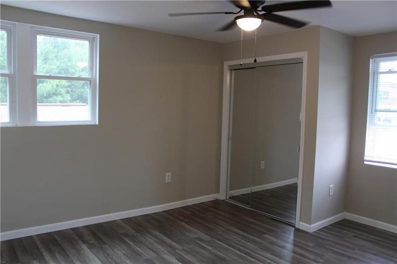 995 A Brodhead Road Coraopolis, PA 15108 - Photo 6 of 10 a view of an empty room with wooden floor and a window