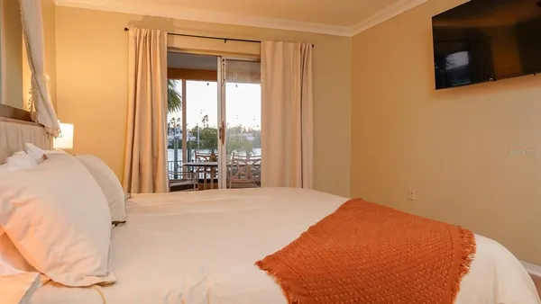 a bed room with a bed and a window