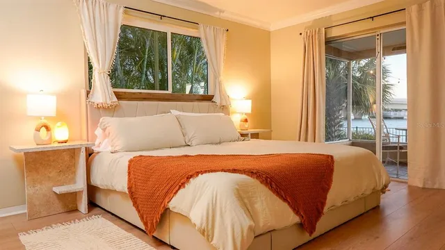 a bedroom with furniture and a window