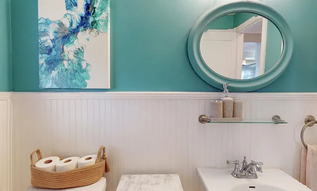 a view of a chairs and table in the balcony