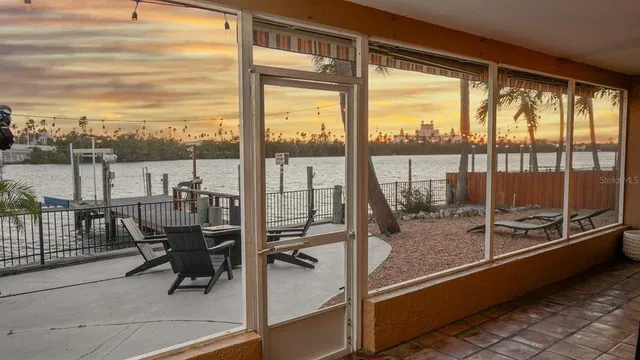 a view of a balcony with furniture and stove