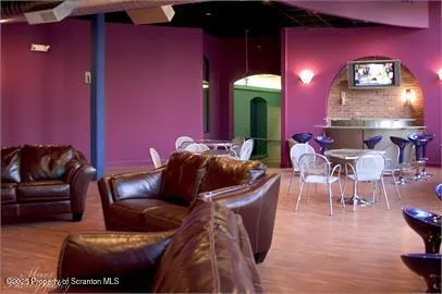 a front view of building with yard and green space