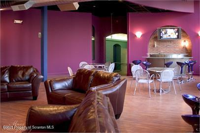800 James Avenue, Unit 1104 Scranton, PA 18510 - Photo 29 of 35 a living room with furniture and a fireplace