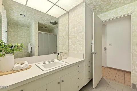a bathroom with a sink and a mirror