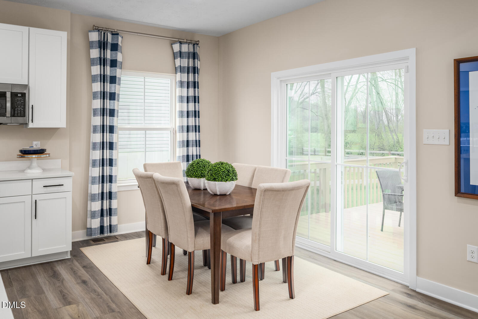 949 Walker Rdg Way Willow Spring, NC 27592 - Photo 11 of 23 a view of a dining room with furniture and wooden floor