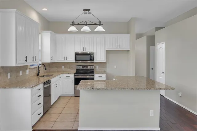 a view of kitchen with wooden floor and window