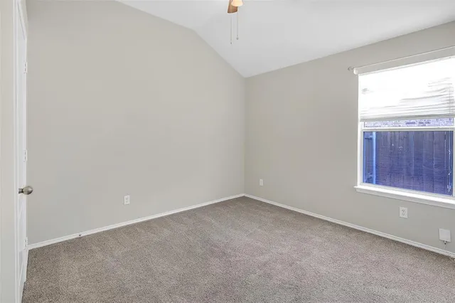 a kitchen with granite countertop a sink a counter space appliances and cabinets