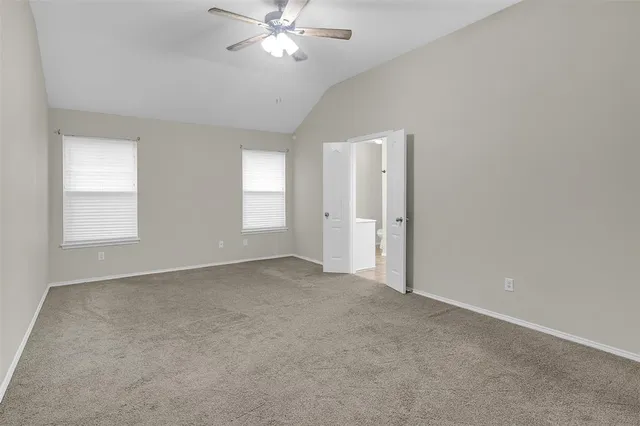 a bathroom with a toilet sink and shower