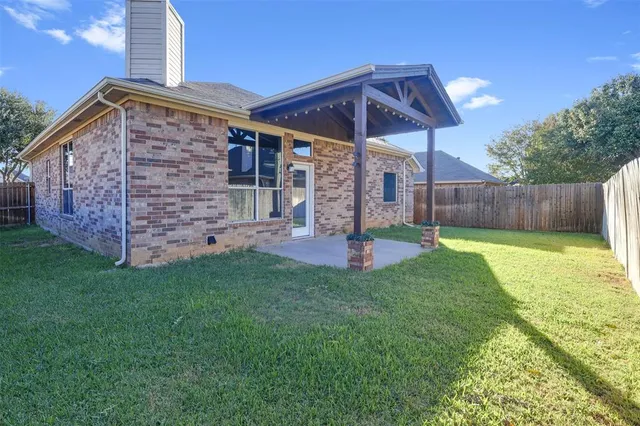 a utility room with cabinets washer and dryer