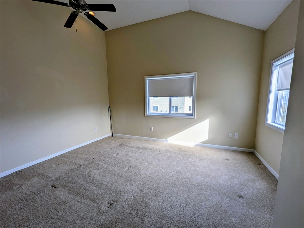 391 America Boulevard, Unit 391 Ashland, MA 01721 - Photo 15 of 22 a view of empty room with windows