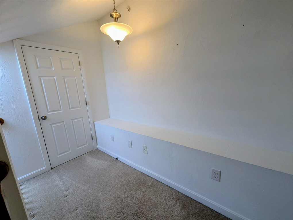 391 America Boulevard, Unit 391 Ashland, MA 01721 - Photo 18 of 22 a view of an empty room