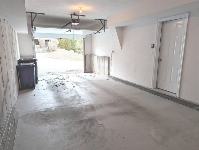 a view of a closet area with furniture and a window