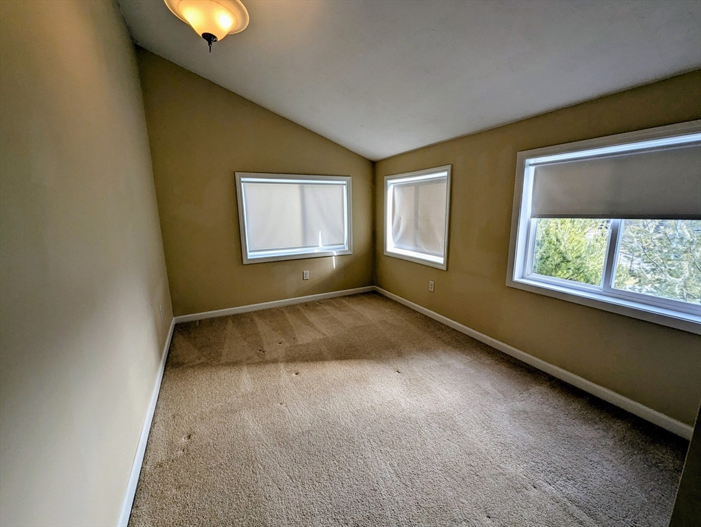 391 America Boulevard, Unit 391 Ashland, MA 01721 - Photo 10 of 22 an empty room with windows