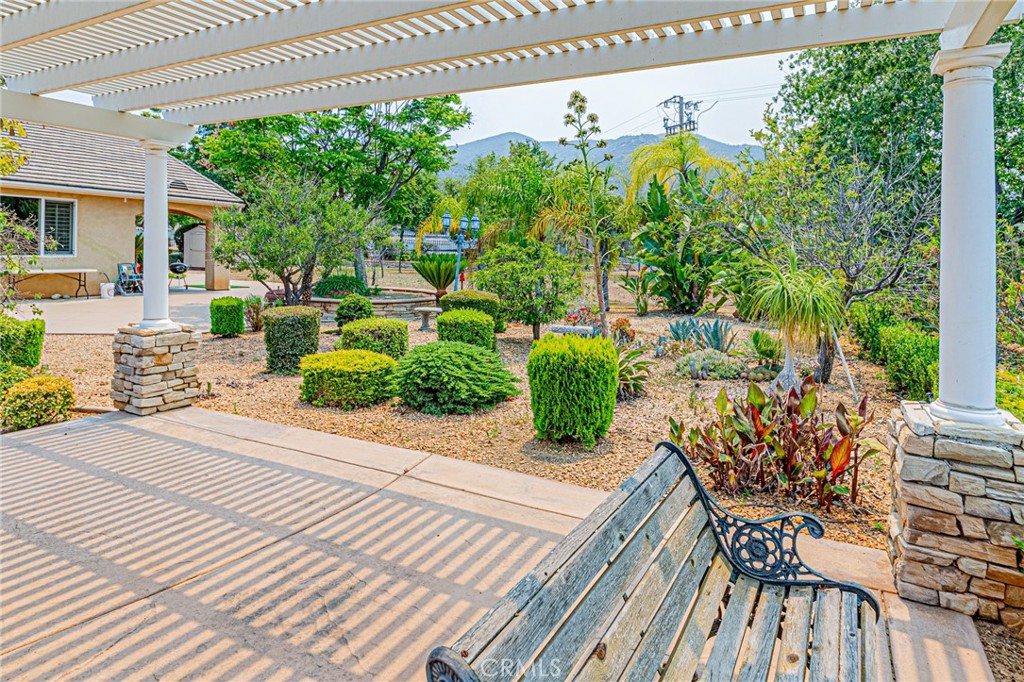 4088 Shady Ridge Circle Corona, CA 92881 - Photo 13 of 47 a view of a porch with furniture and a yard