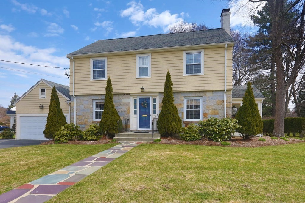 79 Evelyn Road Waban, MA 02468 - Photo 1 of 16 a front view of house with yard and green space