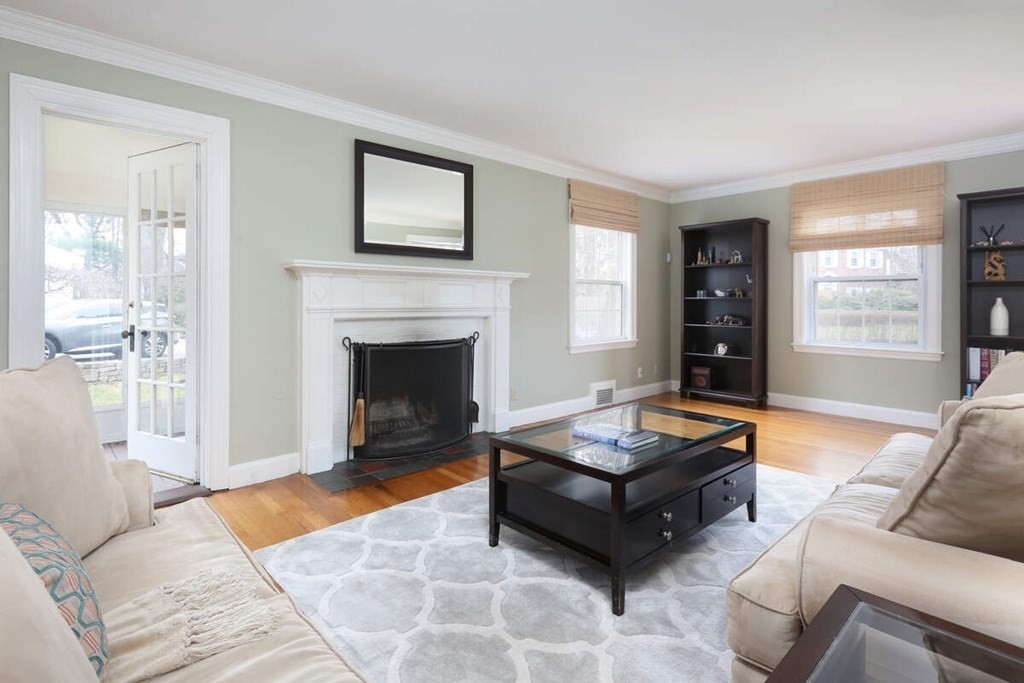 79 Evelyn Road Waban, MA 02468 - Photo 3 of 16 a living room with furniture and a fireplace