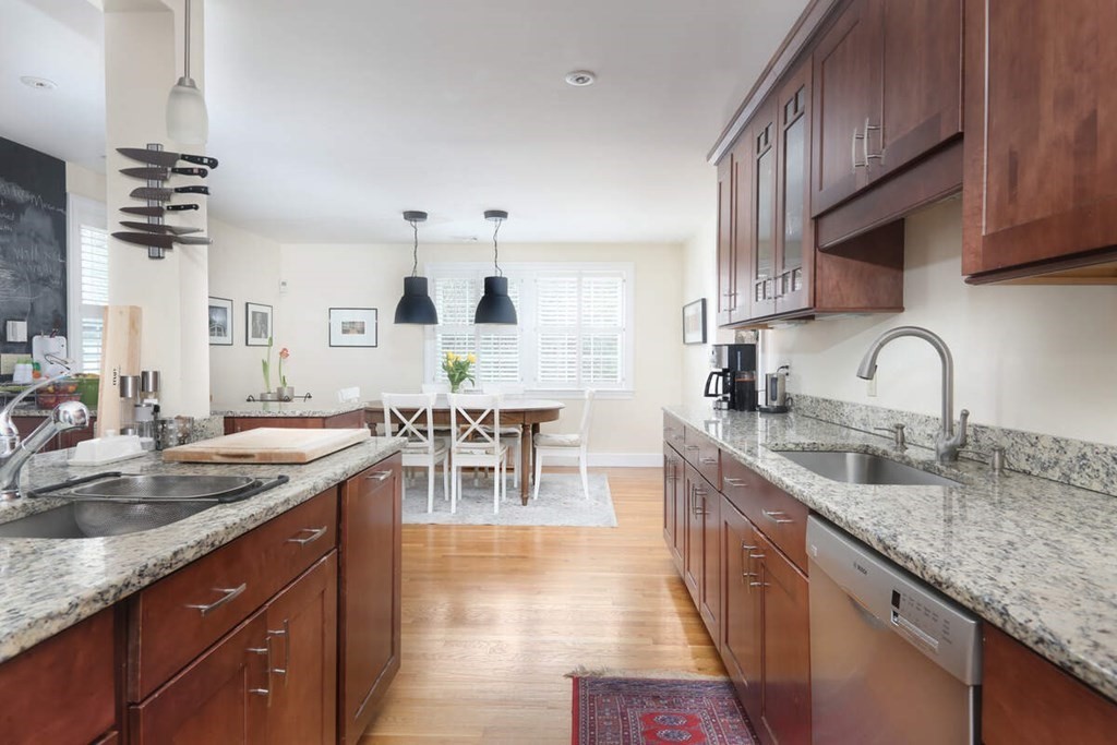 79 Evelyn Road Waban, MA 02468 - Photo 4 of 16 a kitchen with sink stove and cabinets