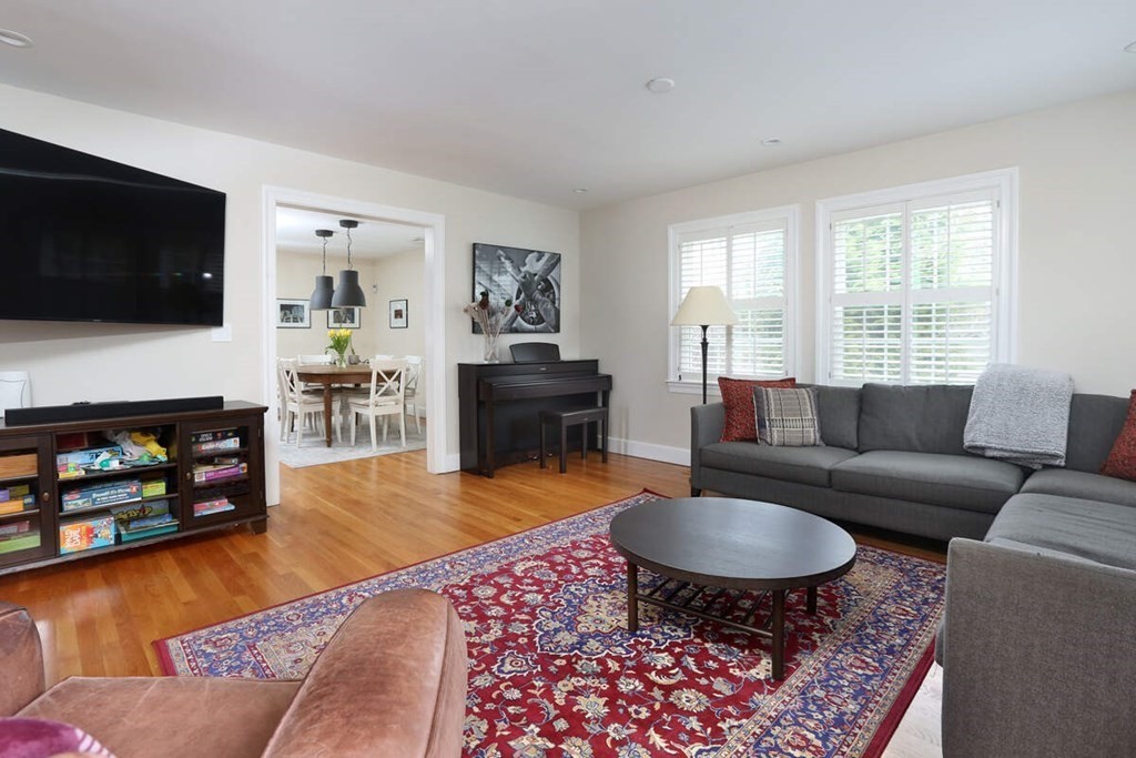 79 Evelyn Road Waban, MA 02468 - Photo 8 of 16 a living room with furniture and a flat screen tv