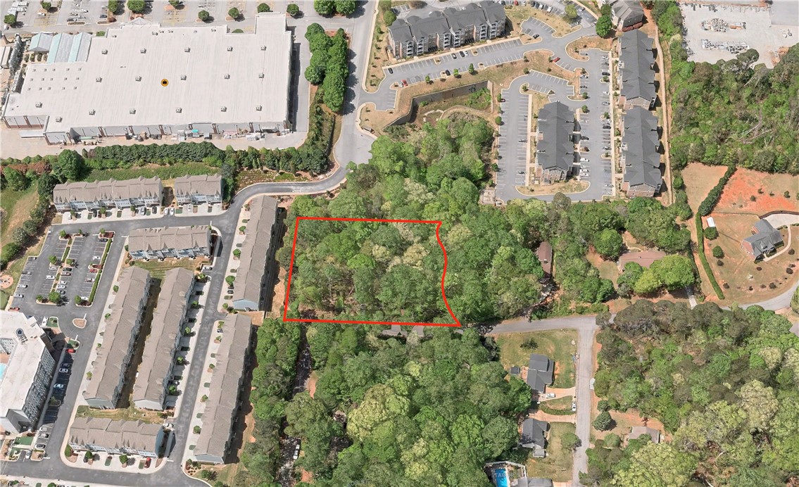 This expansive lot offers a prime opportunity for development amidst a vibrant community.