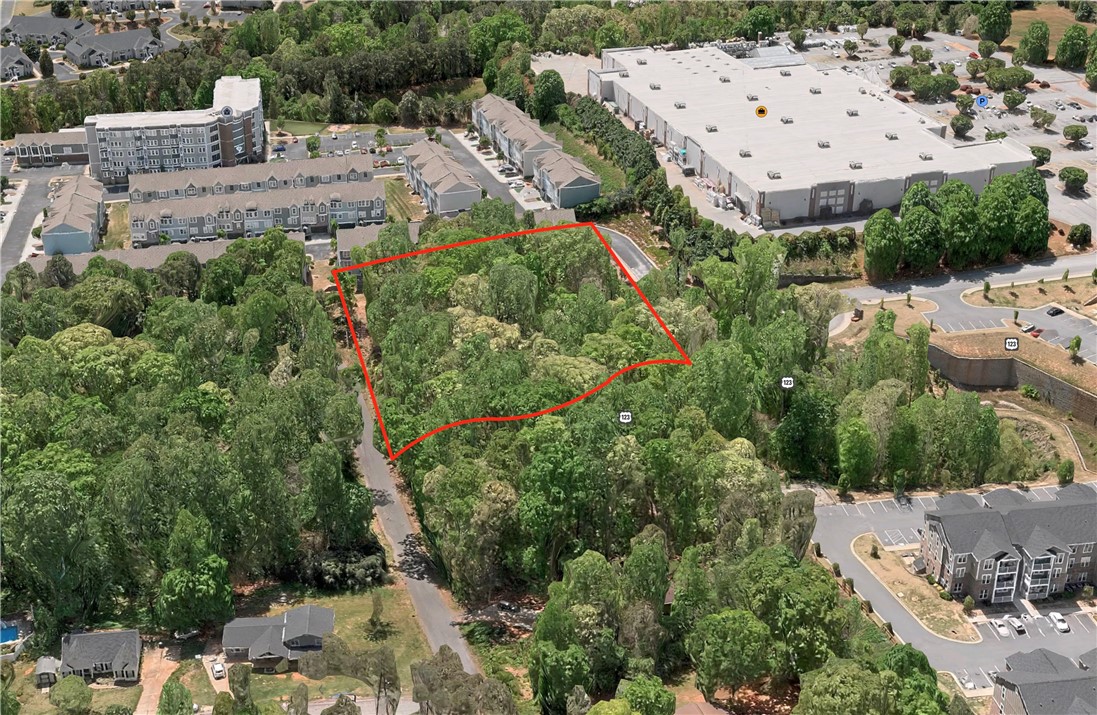 163 Tabor Street Central, SC 29630 - Photo 2 of 7 Discover a tranquil, tree-lined lot, ready for your vision to unfold.