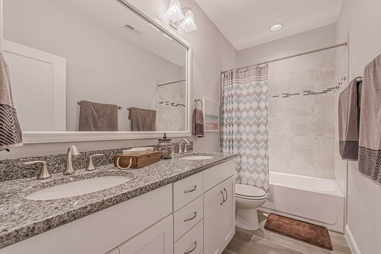7605 Stonehenge Farm Lane Raleigh, NC 27613 - Photo 25 of 30 Large 2nd floor bathroom with granite countertops 2nd floor bathroom