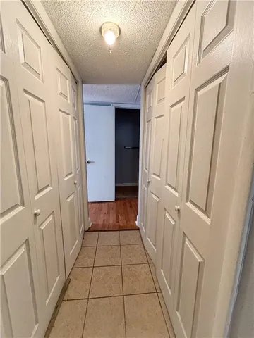 a view of a hallway with a door