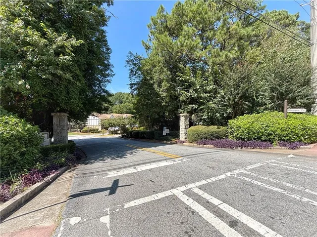 a view of street with large trees