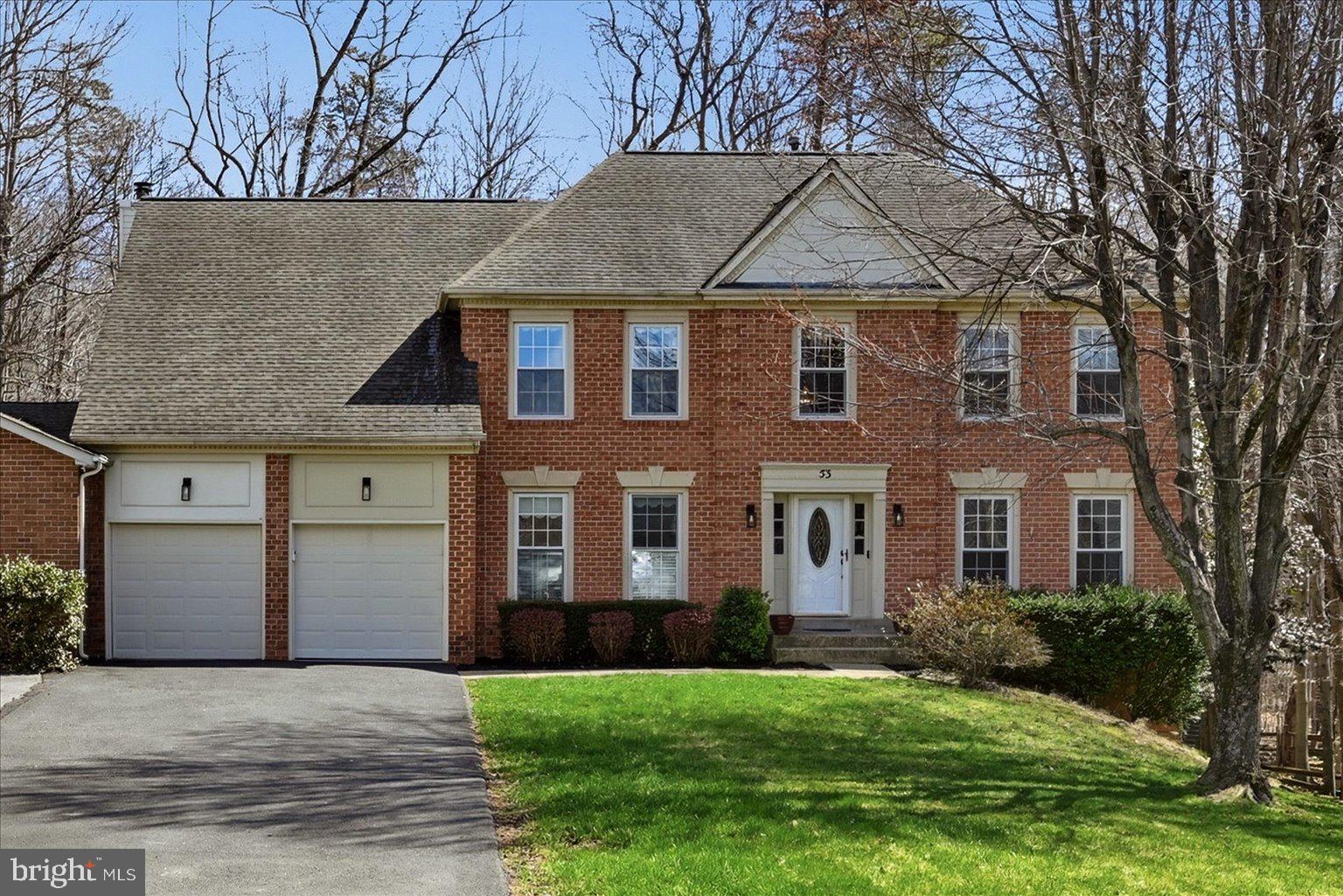 53 Christopher Way Stafford, VA 22554 - Photo 1 of 1 a front view of a house with a yard and garage