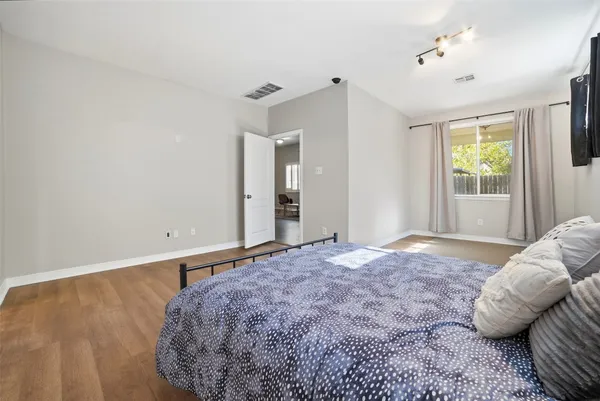 a bedroom with a bed and window