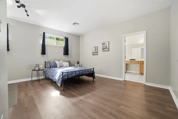 a bedroom with bed and window