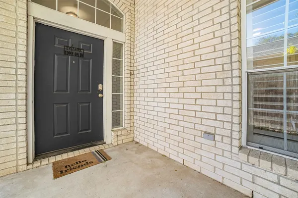 a view of a brick house with a door