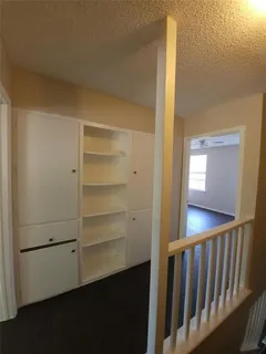 a view of a hallway with closet