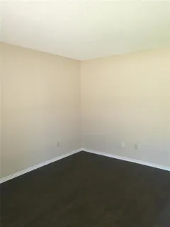 an empty room with a bench