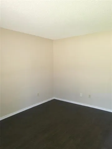 an empty room with a bench