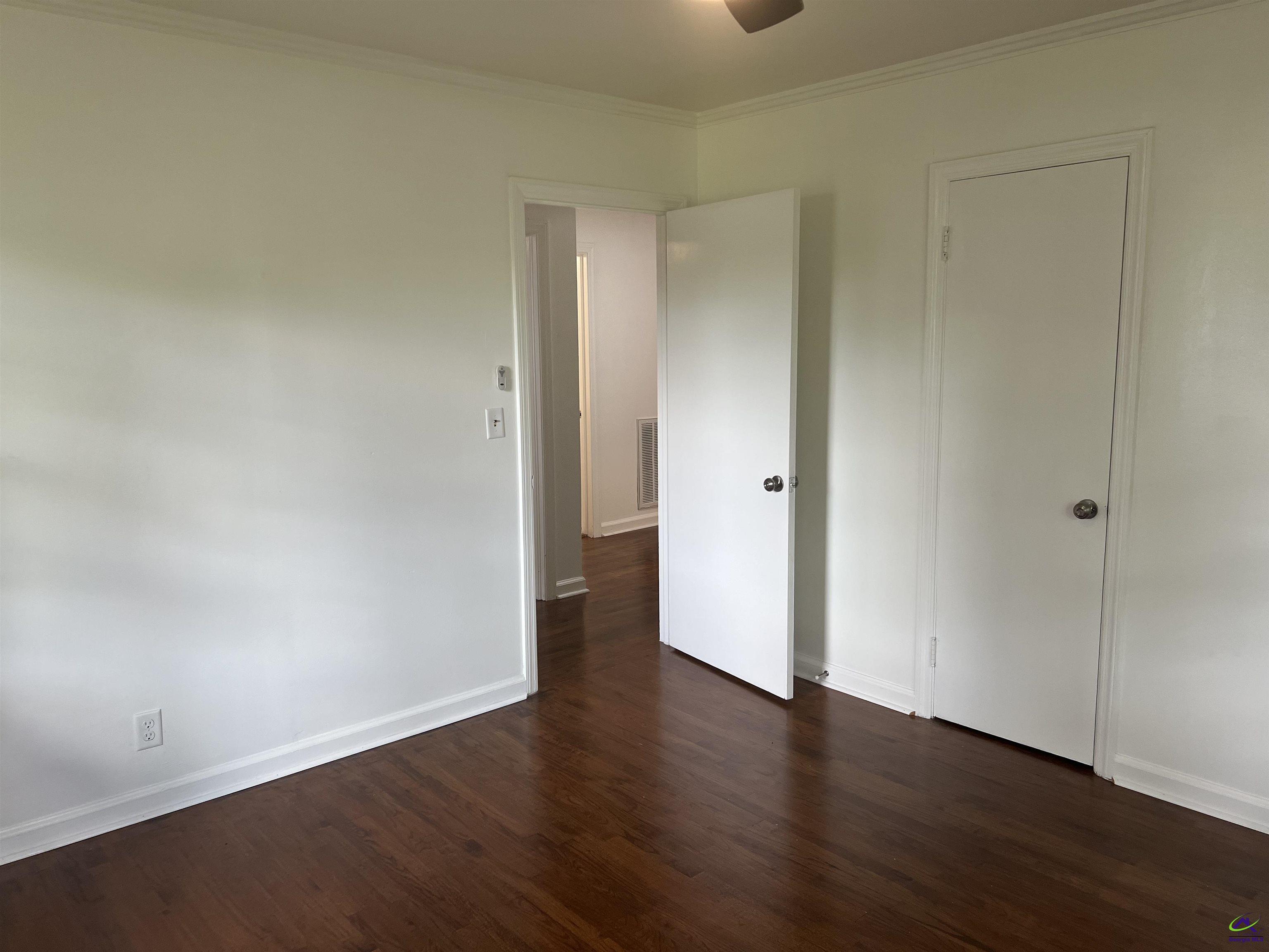 145 South 2nd Street Cochran, GA 31014 - Photo 22 of 24 a view of an empty room with wooden floor