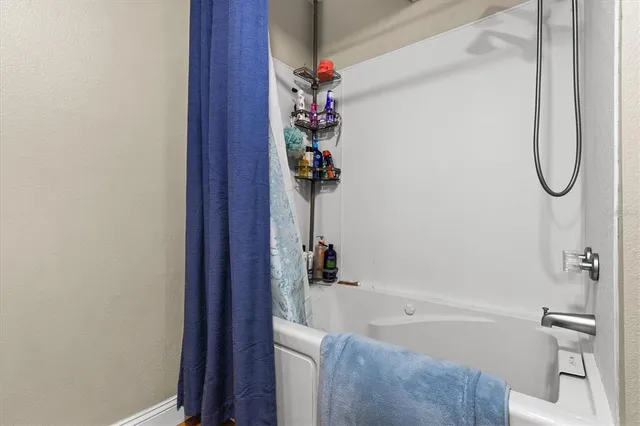 a bed room with furniture and wooden floor