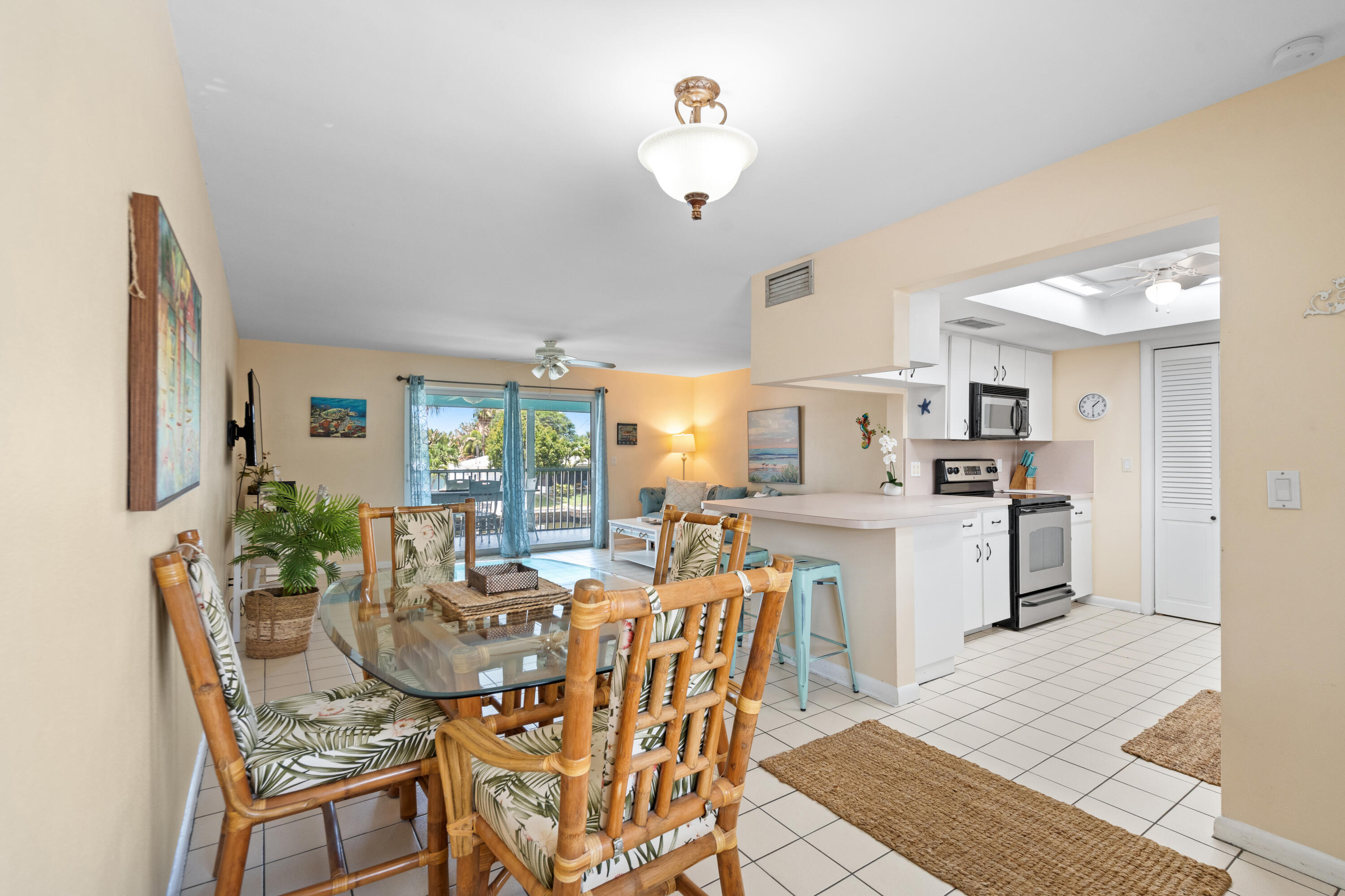 249 Center Street, Unit 2C Jupiter, FL 33458 - Photo 7 of 29 a view of a dining room with furniture and wooden floor